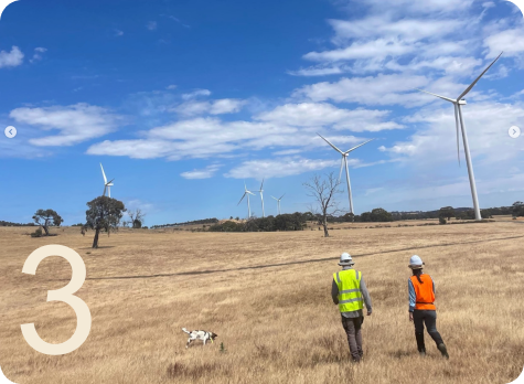 technicians-walking-onshore-wind-farm